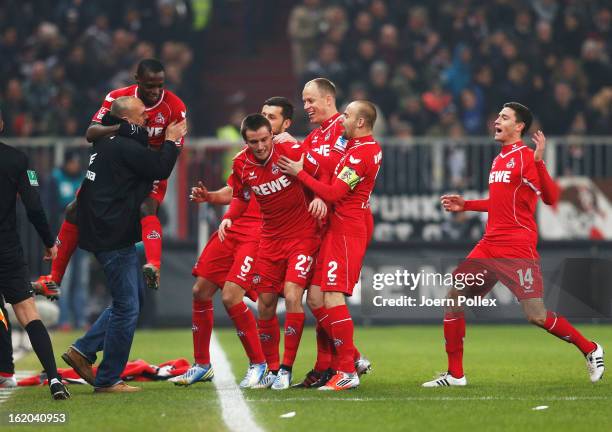 Christian Clemens of Koeln celebrates after scoring his team's first goal during the Second Bundesliga match between FC St. Pauli and 1. FC Koeln at...