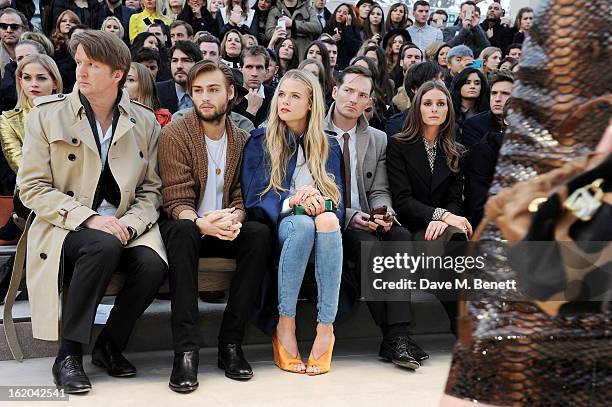 Tom Hooper, Douglas Booth, Gabriella Wilde, Dan Gillespie Sells and Olivia Palermo sit in the front row for the Burberry Prorsum Autumn Winter 2013...