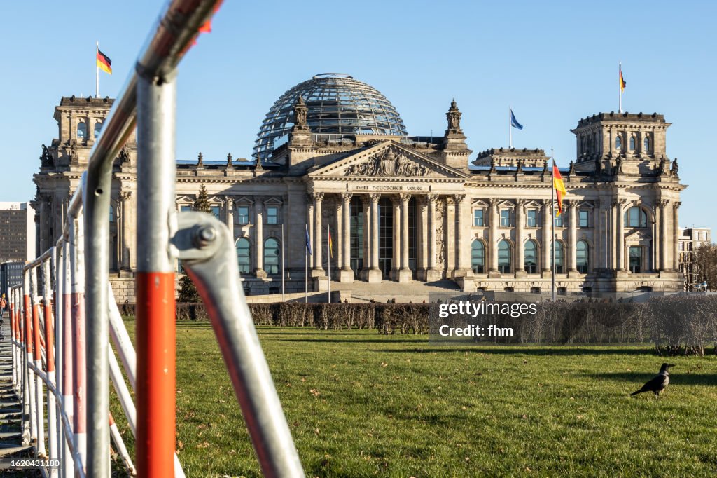 Reichstag building with mobile police fence (German parliament building) - Berlin, Germany