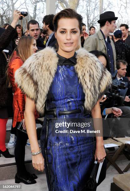 Yasmin Le Bon sits in the front row for the Burberry Prorsum Autumn Winter 2013 Womenswear Show at Kensington Gardens on February 18, 2013 in London,...