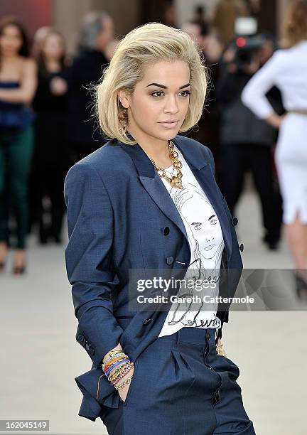 Rita Ora wearing Burberry, arrives at the Burberry Prorsum Autumn Winter 2013 Womenswear Show on February 18, 2013 in London, England.