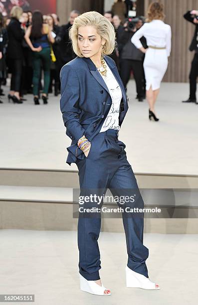 Rita Ora wearing Burberry, arrives at the Burberry Prorsum Autumn Winter 2013 Womenswear Show on February 18, 2013 in London, England.