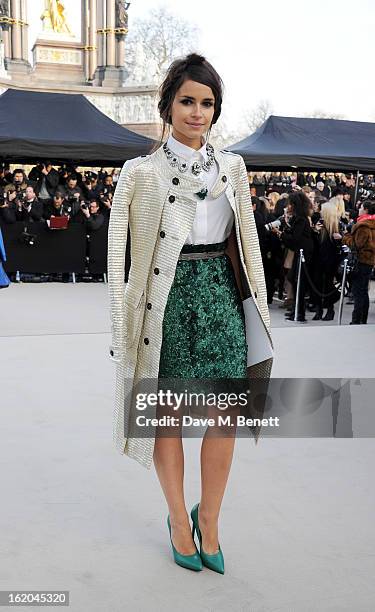 Miraoslava Duma arrives at the Burberry Prorsum 2013 Autumn Winter Womenswear Show at Kensington Gardens on February 18, 2013 in London, England.