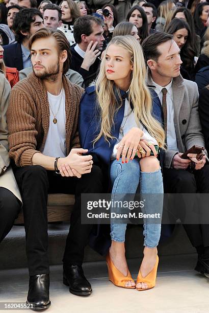Douglas Booth, Gabriella Wilde and Dan Gillespie Sells sit in the front row for the Burberry Prorsum Autumn Winter 2013 Womenswear Show at Kensington...