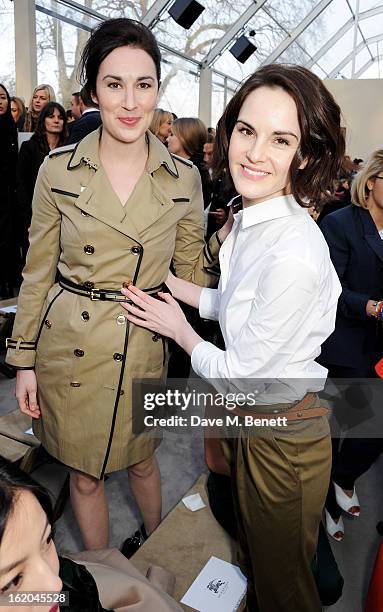 Michelle Dockery and sister attend the Burberry Prorsum Autumn Winter 2013 Womenswear Show at Kensington Gardens on February 18, 2013 in London,...