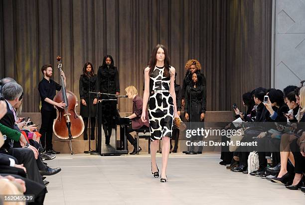 Singer Tom Odell performs at the Burberry Prorsum Autumn Winter 2013 Womenswear Show at Kensington Gardens on February 18, 2013 in London, England.
