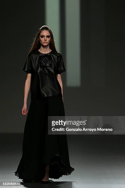 Model showcases designs by Teresa Helbig on the runway at the Teresa Helbig show during Mercedes Benz Fashion Week Madrid Fall/Winter 2013/14 at...