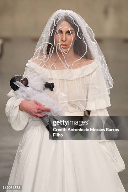 Model walks the runway at the Fashion East show during London Fashion Week Fall/Winter 2013/14 at TopShop Show Space on February 18, 2013 in London,...