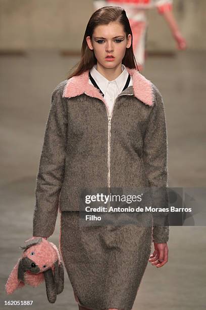 Model walks the runway at the Fashion East show during London Fashion Week Fall/Winter 2013/14 at TopShop Show Space on February 18, 2013 in London,...