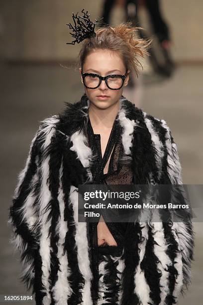 Model walks the runway at the Fashion East show during London Fashion Week Fall/Winter 2013/14 at TopShop Show Space on February 18, 2013 in London,...