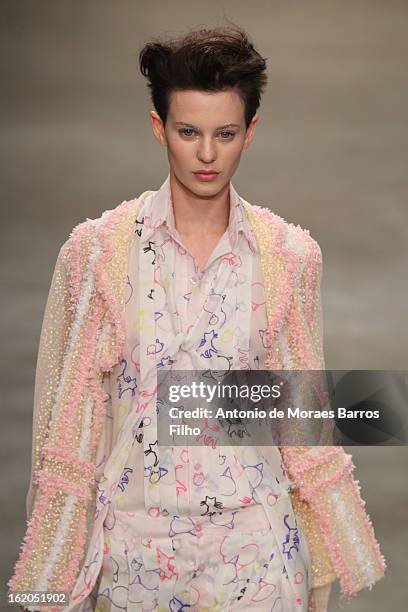 Model walks the runway at the Fashion East show during London Fashion Week Fall/Winter 2013/14 at TopShop Show Space on February 18, 2013 in London,...