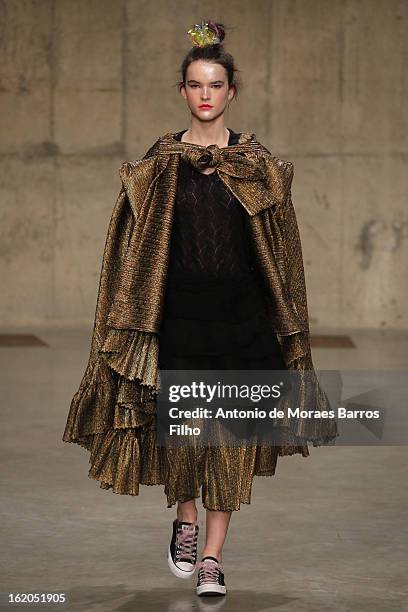 Model walks the runway at the Fashion East show during London Fashion Week Fall/Winter 2013/14 at TopShop Show Space on February 18, 2013 in London,...