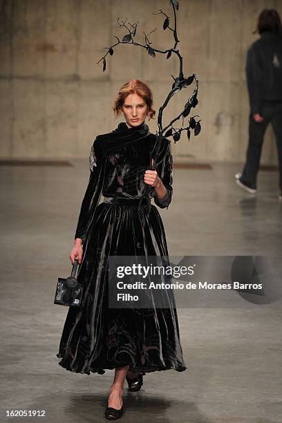 Model walks the runway at the Fashion East show during London Fashion Week Fall/Winter 2013/14 at TopShop Show Space on February 18, 2013 in London,...