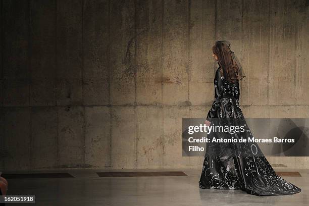 Model walks the runway at the Fashion East show during London Fashion Week Fall/Winter 2013/14 at TopShop Show Space on February 18, 2013 in London,...