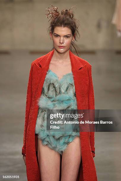 Model walks the runway at the Fashion East show during London Fashion Week Fall/Winter 2013/14 at TopShop Show Space on February 18, 2013 in London,...