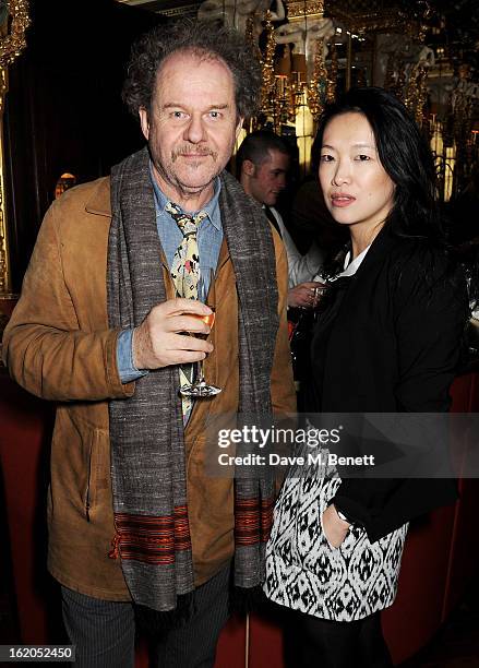 Mike Figgis and Rosey Chan attend the AnOther Magazine and Dazed & Confused party with Belvedere Vodka at the Cafe Royal hotel on February 18, 2013...