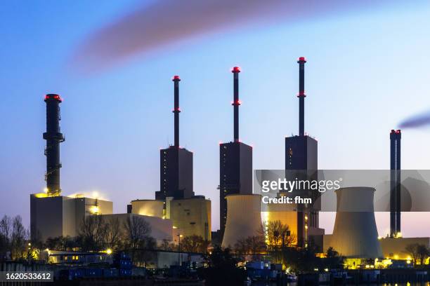 thermal power station at blue hour ( - district heating plant stock pictures, royalty-free photos & images