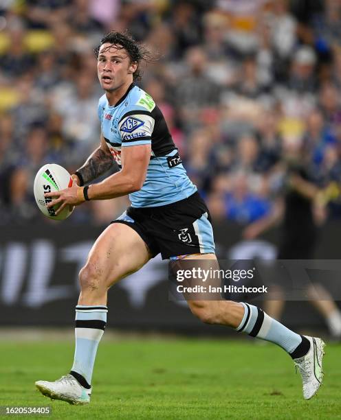 Nicho Hynes of the Sharks runs the ball during the round 25 NRL match between North Queensland Cowboys and Cronulla Sharks at Qld Country Bank...