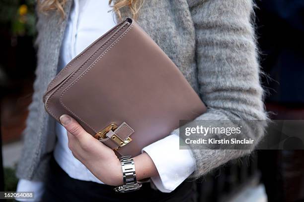Anouk Bos carries a Hulhmi clutch on day 3 of London Womens Fashion Week Autumn/Winter 2013 on February 17, 2013 in London, England.
