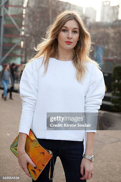 Freelance fashion journalist Camille Charriere wears unique topshop, H&M Bag, on day 3 of London Womens Fashion Week Autumn/Winter 2013 on February...