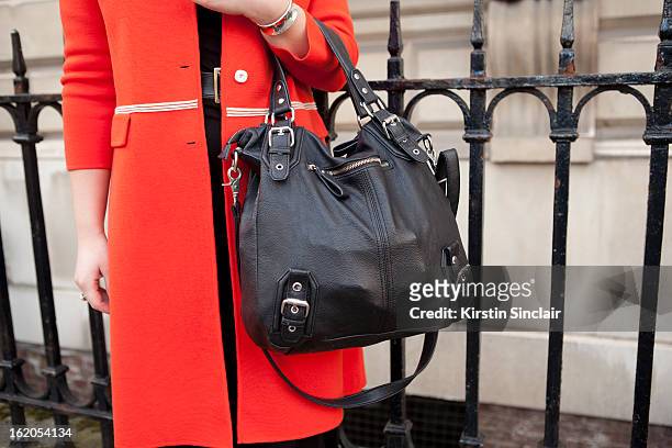 Costume Designer Olivia Hulme wears a Urban Outfitters purse and vintage jacket, , on day 3 of London Womens Fashion Week Autumn/Winter 2013 on...