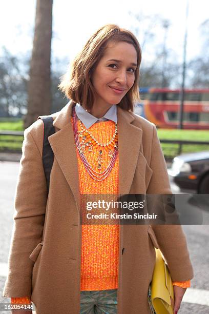 Tiany Kiriloff wears a Jill Sanders jacket, Kenzo sweater and Delvaux clutch on day 3 of London Womens Fashion Week Autumn/Winter 2013 on February...