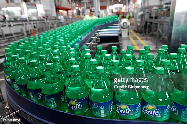Bottles of Sprite move along a conveyor belt at a Coca-Cola Amatil Ltd. Plant in Medan, North Sumatra province, Indonesia, on Friday, Feb. 15, 2013....