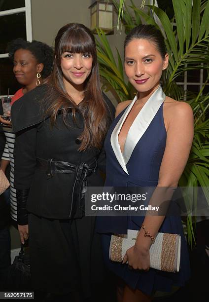 Actress Hannah Simone and Olivia Munn wearing Juicy Couture attend Vanity Fair and Juicy Couture's Celebration of the 2013 Vanities Calendar hosted...