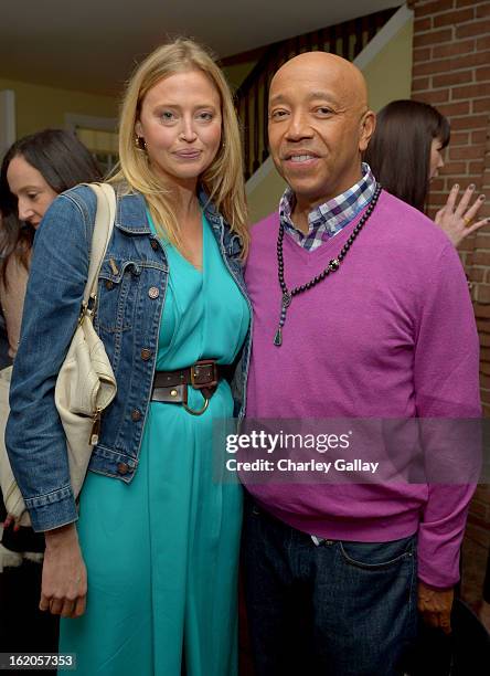 Actress Estella Warren and Russell Simmons attend Vanity Fair and Juicy Couture's Celebration of the 2013 Vanities Calendar hosted by Vanity Fair...