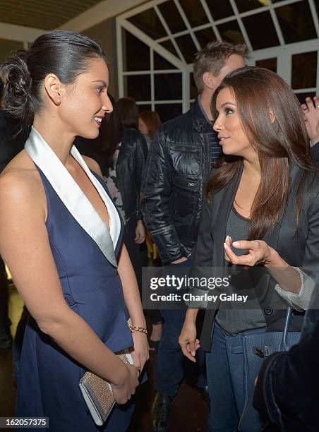 Actors Olivia Munn wearing Juicy Couture and Eva Longoria attend Vanity Fair and Juicy Couture's Celebration of the 2013 Vanities Calendar hosted...