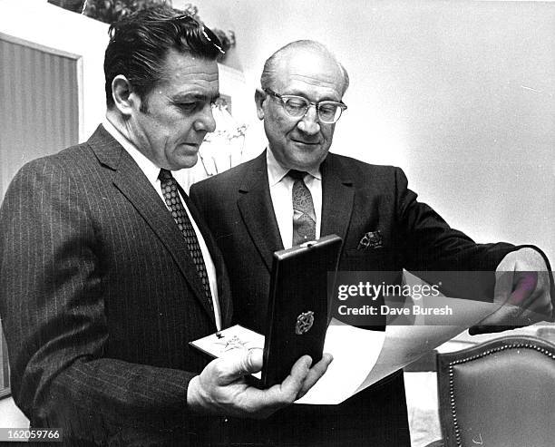 Mario Anziano, Left, Italian Consul, Bestows Title On Albert Zarlengo; Long-time Denver attorney was awarded Knight of the Star of Italian...