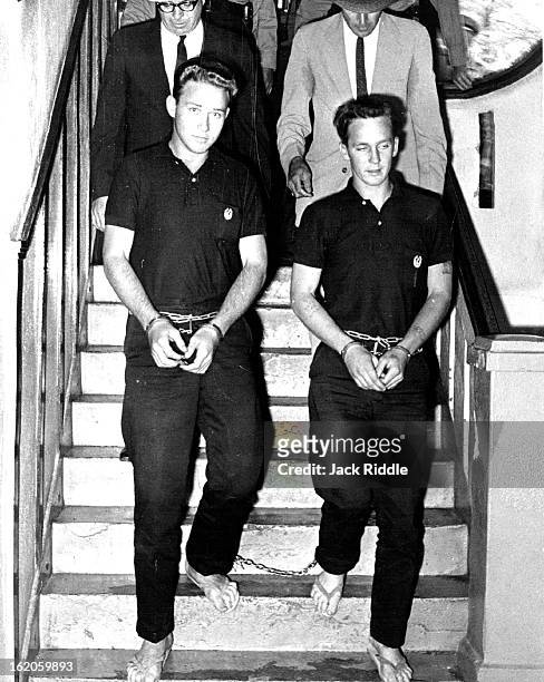 Slayers Forbidden To Wear Shoes; Confessed killers George R. York and James D. Latham walk down a stairway of Wallace County Court-¡ house. On their...