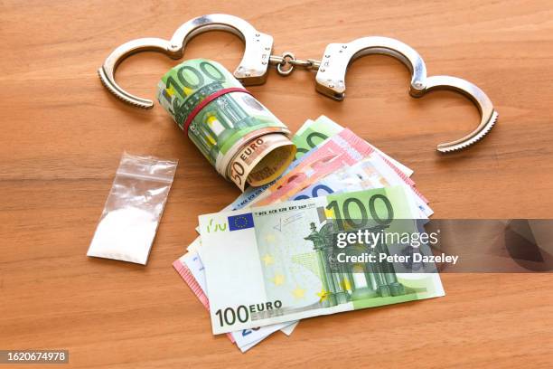 drugs, handcuffs and euro banknotes - one hundred euro banknote stock pictures, royalty-free photos & images