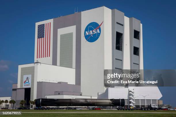 SpaceX Falcon 9 rocket drives pass in front of the Vehicle Assembly Building at the Kennedy Space Center on August 24, 2023 in Cape Canaveral,...