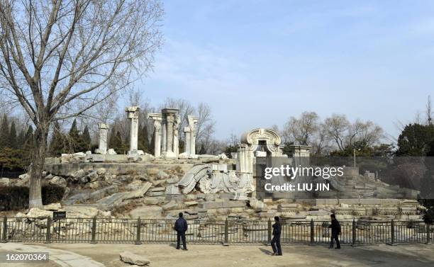 Tourist look at the ruins of the Guanshuifa Fountain which was built in 1759 during the period of Qing Emperor Qianlong, at the Old Summer Palace,...