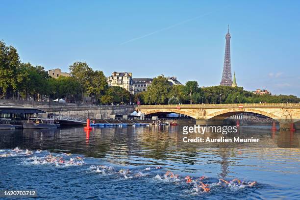 General view as athletes swim in the Seine river in front of the Eiffel Tower during the Women World Triathlon on August 17, 2023 in Paris, France.