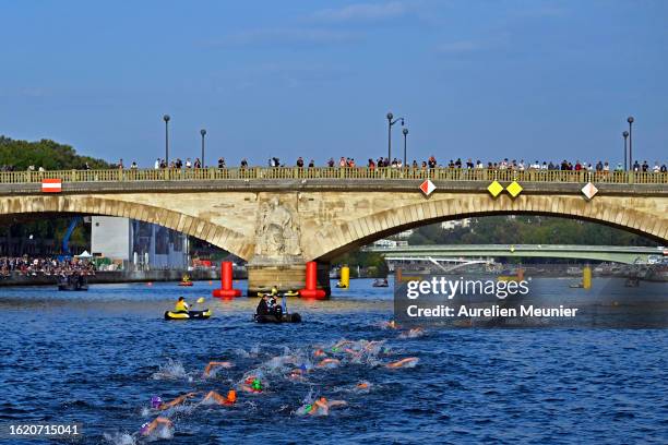 View as athletes swim in the Seine river in front of the Pont Des Invalides during the Women World Triathlon on August 17, 2023 in Paris, France.
