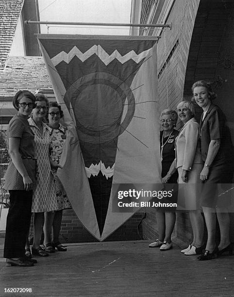 Banner Graces Foothills art Center Entrance; Embroiderer's Guild made banner over entrance of art center in Golden. Women who worked on it included,...