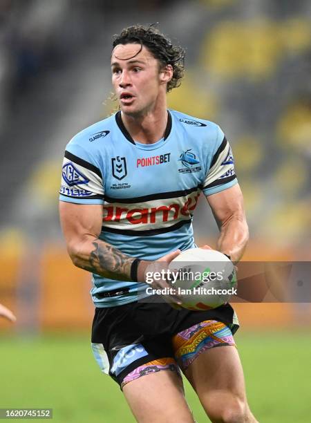 Nicho Hynes of the Sharks runs the ball during the round 25 NRL match between North Queensland Cowboys and Cronulla Sharks at Qld Country Bank...