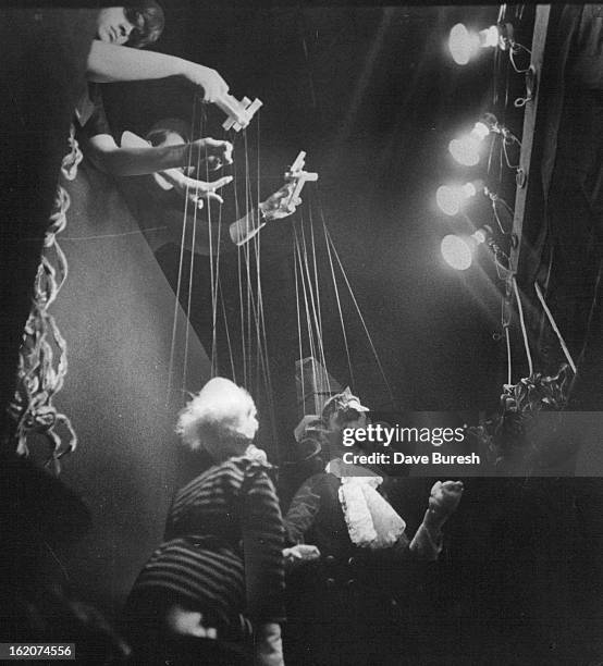 Marionettes do their thing during children's matinee at Elitch's; Black lighting is used to create a new dimension in staging the puppet performance.;