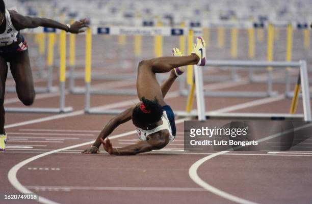 American athlete Gail Devers falls at the last hurdle during the final of the women's 100 metres hurdles event at the 1992 Summer Olympics, held at...