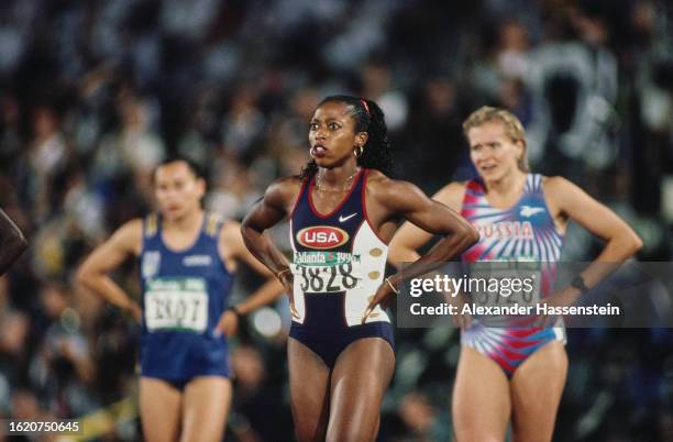 American athlete Gail Devers, with Ukrainian athlete Zhanna Pintusevich and Russian athlete Natalya Voronova in the background, ahead of the final of...