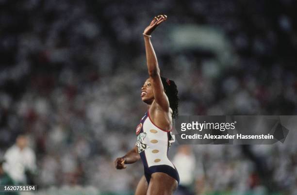 American athlete Gail Devers waves to the spectators ahead of the final of the women's 100 metres event at the 1996 Summer Olympics, held at the...