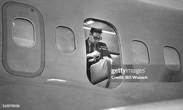 An FBI agent checks the hijacked DC-9. Denver police entered the plane after it landed and found bomb they described as "a workable incendiary...