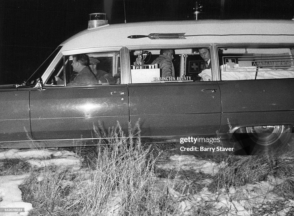 JAN 20 1972, JAN 21 1972; An ambulance carries hijack suspect from the scene of his arrest in a stub
