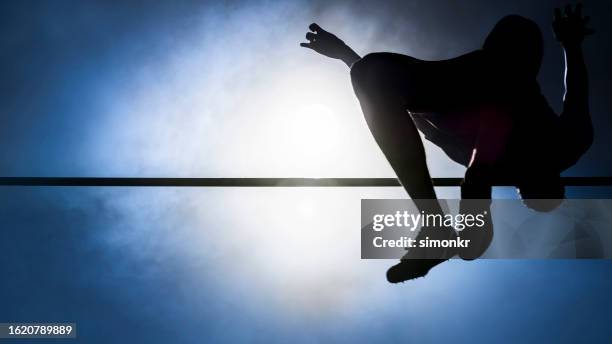 athlete man doing high jump - pole vault stock pictures, royalty-free photos & images