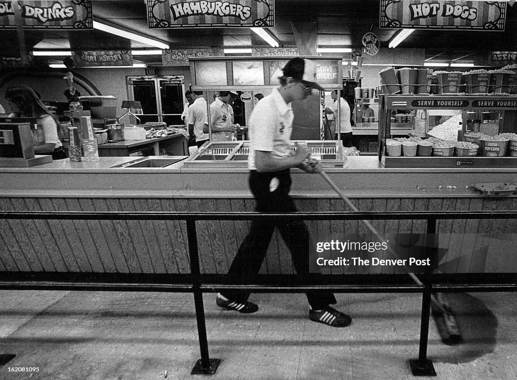 AUG 20 1982, AUG 29 1982; Cinderella Twin employee mops up after concession stand is stormed;