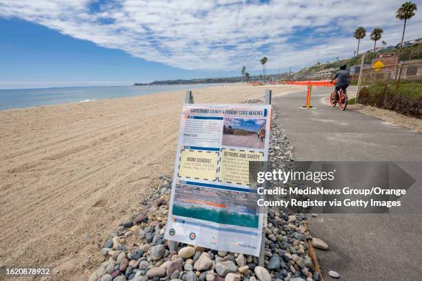 Sign at Capistrano Beach in Dana Point on Monday, August 21, 2023 details the work schedule for the sand replenishment project at Capo and Doheny...