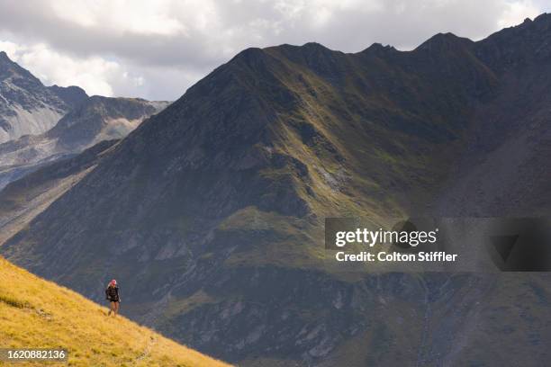 a young woman hiking in switzerland - mont blanc massif stock pictures, royalty-free photos & images