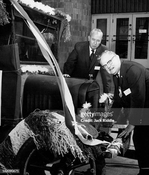 Paul Shaver, Right, Retiring Mid-Continent Eagles President, Cranks Uo; Rex Plyer of Ogden, Utah, new regional president, looks on as 1916 Model T...